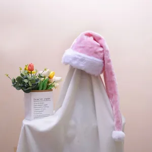 Pink plush Christmas hat with white faux fur trim and pom-pom for party decor