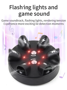 Top view of the shock lie detector with finger slots and mode start control buttons