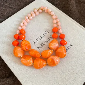 Double-layered acrylic beaded necklace with orange marble texture and pink resin beads