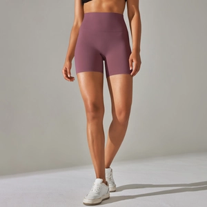 Macro detail of high-waist magenta yoga shorts with breathable peach-lift seamless fit