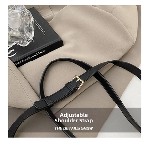 Adjustable black leather shoulder strap with gold buckle detail for radio style box bag