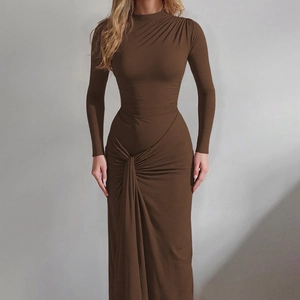 Detail of slim fit maxi dress showing waist ruching and brown stretch fabric texture
