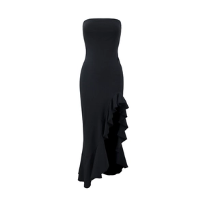 Detailed view of the side slit and asymmetric ruffle hem on this elegant black evening gown