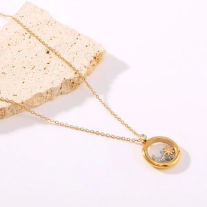 18K gold plated necklace with sun moon star charms in a round glass pendant