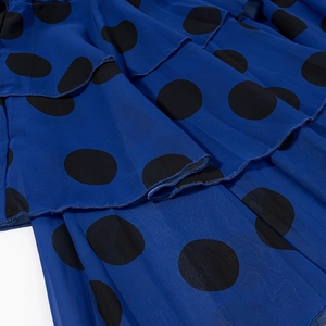 Blue chiffon polka dot dress with layered ruffles and elegant tiered cake skirt design