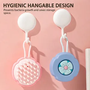 Silicone scalp massage brush with cartoon design and hanging rope in pink and blue