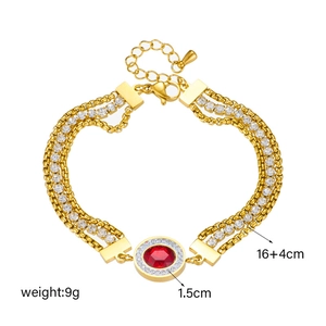 Vintage gold layered chain bracelet with red gemstone and sparkling rhinestones