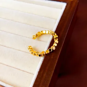 Minimalist gold plated geometric bead open ring displayed on a velvet jewelry tray