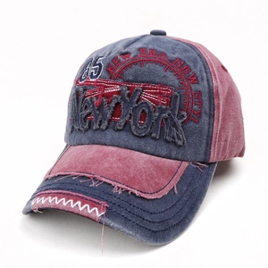 Vintage washed baseball cap in blue and red with New York embroidery 45-degree angle view
