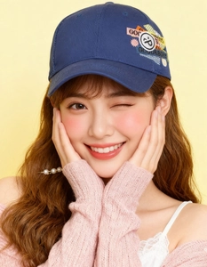 Detail of navy blue baseball cap with colorful GOOD BOYS embroidery on the side