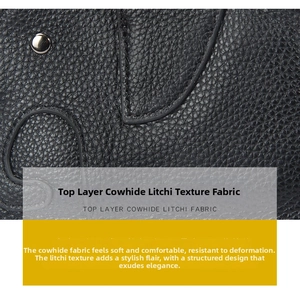 Close-up of black genuine leather wallet showing detailed lychee grain and silver rivet