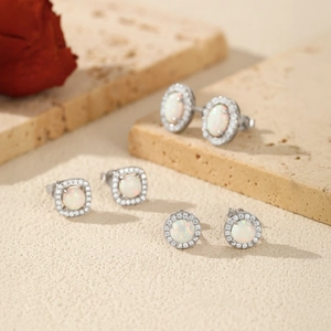 S925 sterling silver stud earrings with white opal center and sparkling cubic zirconia halo