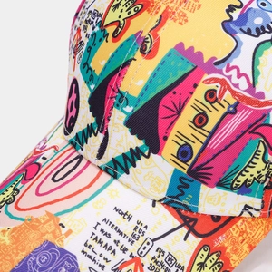 Close-up detail of street style graffiti print and high-quality stitching on baseball cap