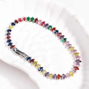 Macro detail of rainbow marquise-cut cubic zirconia link chain with silver plating