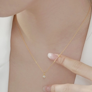 Elegant gold S925 sterling silver cross and round zircon pendant necklace worn on neck