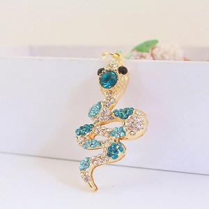 Golden snake keychain with emerald green crystals and sparkling rhinestone embellishments