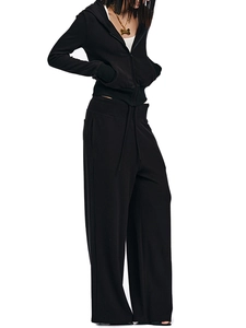 Detail of soft black velvet hoodie and high-waist wide-leg drawstring sweatpants set
