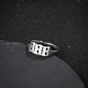 Macro shot of silver-tone stainless steel adjustable ring featuring 11:11 cutout design