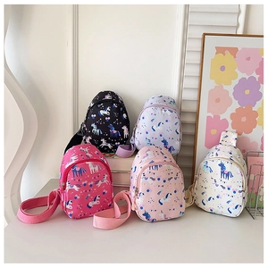 Close-up of lightweight nylon kids chest bags with colorful unicorn and star patterns