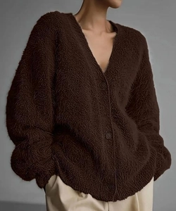 Detailed texture of dark brown plush knit cardigan with fuzzy faux mink fabric and buttons