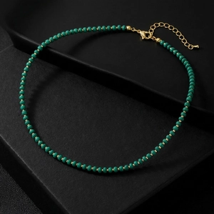Handmade emerald green beaded necklace with gold spacers and adjustable lobster clasp