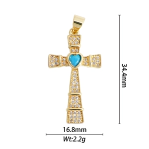 Pendentif croix en cuivre doré avec micro-pavage de zircons et gemme cœur bleue
