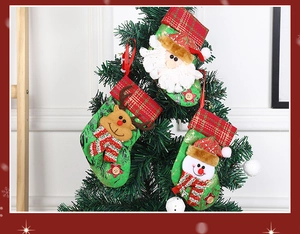 Three-piece Christmas stocking set featuring Santa, Reindeer and Snowman on a tree