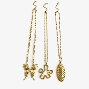 Three gold butterfly flower and leaf pendants on paperclip necklaces for women