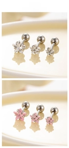Macro shot of star zircon screw-back earrings in white and pink, three size options