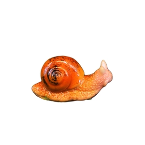 Realistic orange snail miniature resin ornament with lifelike texture on white background