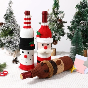 Christmas knitted wine bottle covers with Santa, snowman and reindeer festive designs