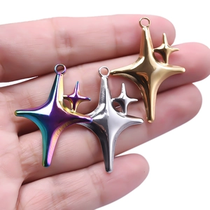Star-shaped 304 stainless steel pendants in gold, silver and rainbow colors on a hand