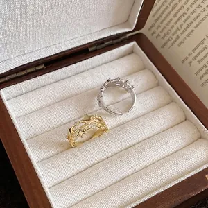 Elegant three-layer star open ring with sparkling cubic zirconia on white velvet jewelry box