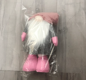 Pink Nordic Christmas gnome plush doll with long white beard in transparent packaging