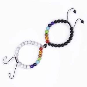 Detail of heart magnet stone bracelets for couples with colorful 7 chakra beads and cord