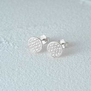 Detail view of 925 silver C-shaped stud earrings with micro-pave clear cubic zirconia stones