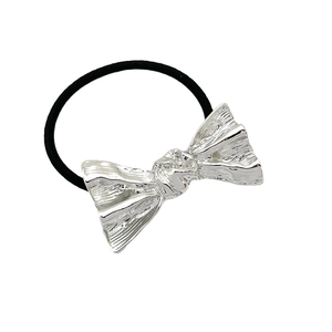Black elastic hair tie with a silver textured metal bow for high ponytail styling