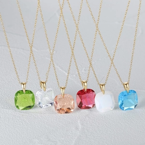 Detailed row of square-cut colorful crystal pendants on fine gold chain necklaces