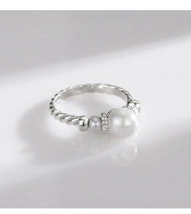 Detailed close-up of S925 silver pearl ring with spiral texture on white background