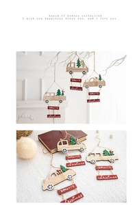Detail of wooden Christmas truck pendants featuring Merry Christmas signs and festive colors