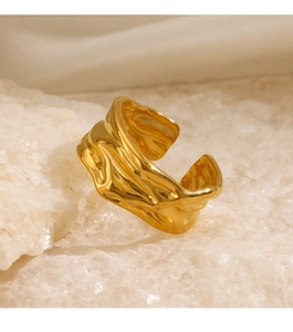 Close-up of irregular wave texture and gold plating on adjustable open lava ring
