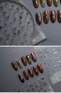 Macro detail of M093 metallic gold 3D nail stickers featuring star moon and line patterns