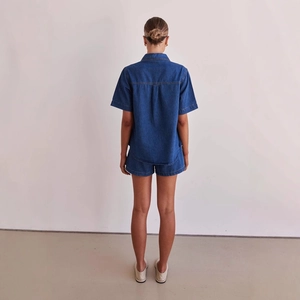 Women's vintage washed dark blue denim short sleeve shirt and shorts set back view