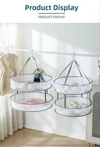 Detail view of a double-layer mesh drying rack with windproof hook and grey trim