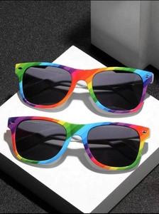 Detail of two rainbow striped sunglasses with black lenses and classic frame design