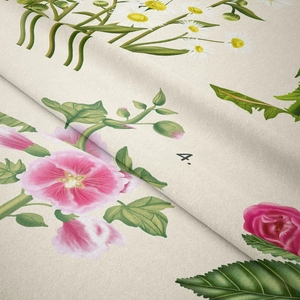 Close-up of vintage floral tapestry fabric with botanical illustrations and soft folds