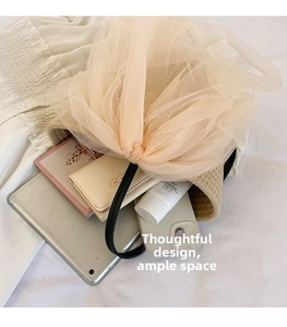 Detail view of woven handbag interior featuring large capacity for daily essentials