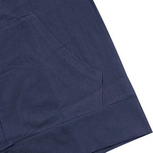 Detail view of navy blue linen blend trousers showing side pocket and durable double stitching