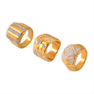 Three gold-plated geometric rings with sparkling rhinestone textures on a white background
