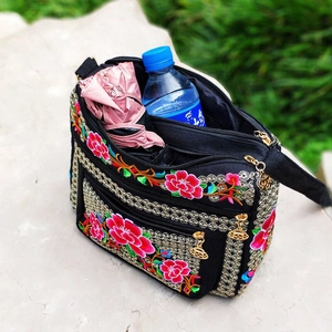 Ethnic canvas crossbody bag with floral embroidery and multi-layer zipper storage